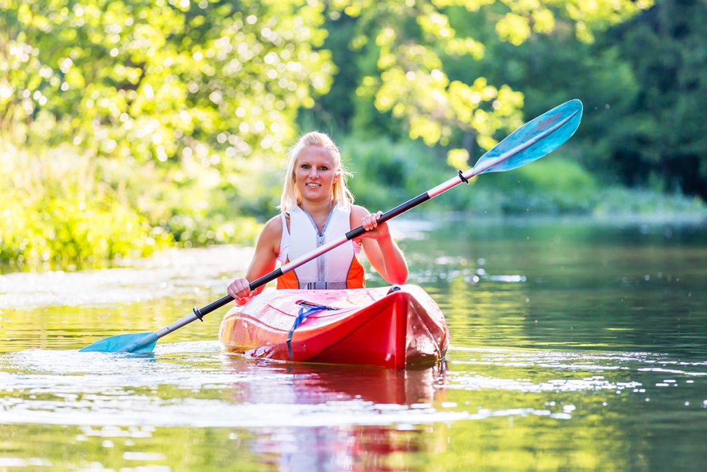 Woman kayaking "in the flow"